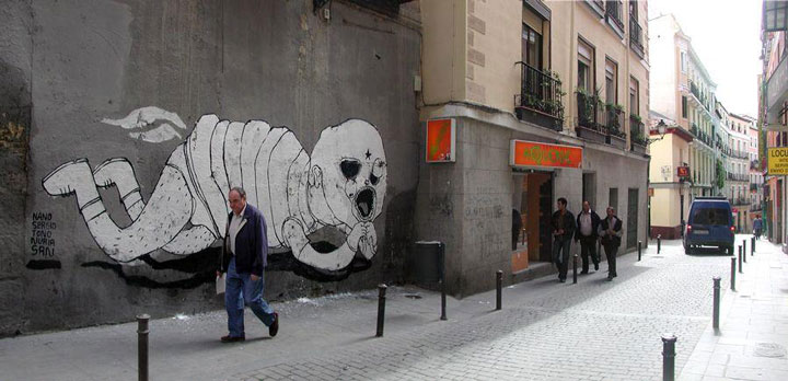 blu-lartiste-urbain-qui-metamorphose-les-facades-dimmeubles-avec-ses-peintures-engagees110