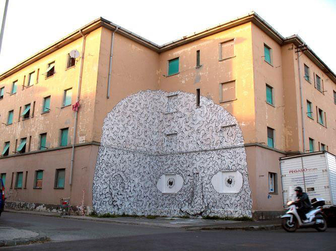 blu-lartiste-urbain-qui-metamorphose-les-facades-dimmeubles-avec-ses-peintures-engagees28