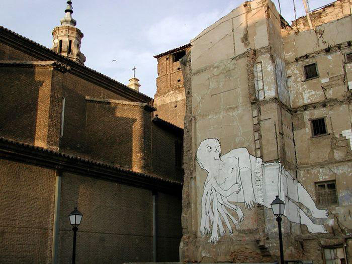 blu-lartiste-urbain-qui-metamorphose-les-facades-dimmeubles-avec-ses-peintures-engagees32