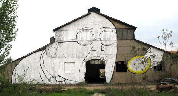 blu-lartiste-urbain-qui-metamorphose-les-facades-dimmeubles-avec-ses-peintures-engagees52
