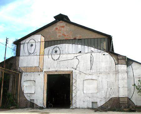 blu-lartiste-urbain-qui-metamorphose-les-facades-dimmeubles-avec-ses-peintures-engagees54