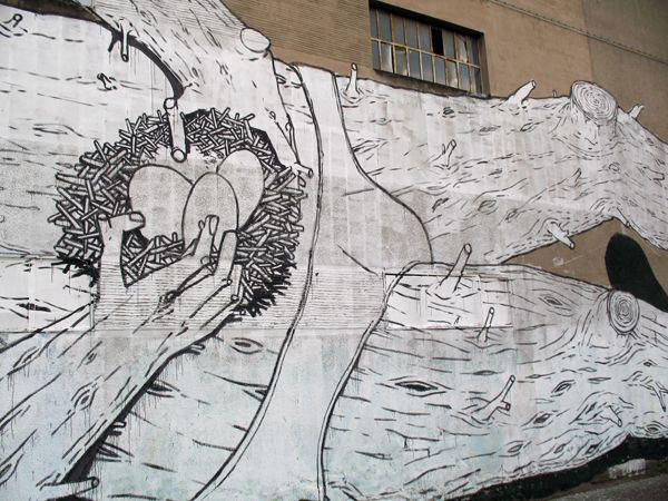 blu-lartiste-urbain-qui-metamorphose-les-facades-dimmeubles-avec-ses-peintures-engagees70
