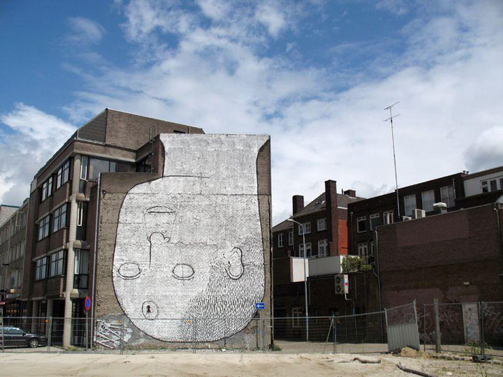blu-lartiste-urbain-qui-metamorphose-les-facades-dimmeubles-avec-ses-peintures-engagees86